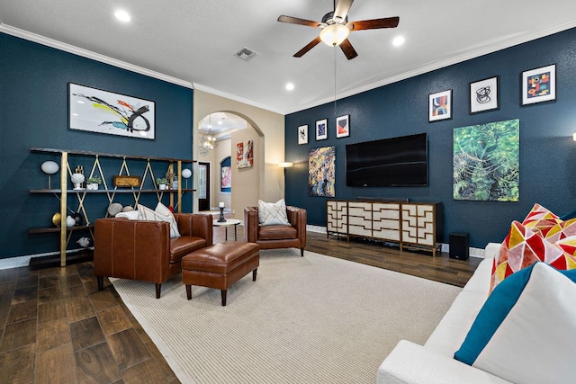 20012 Moorlynch Ave, Pflugerville, TX 78660 - living room with a ceiling fan, ornamental molding, arched walkways, recessed lighting, and wood finished floors