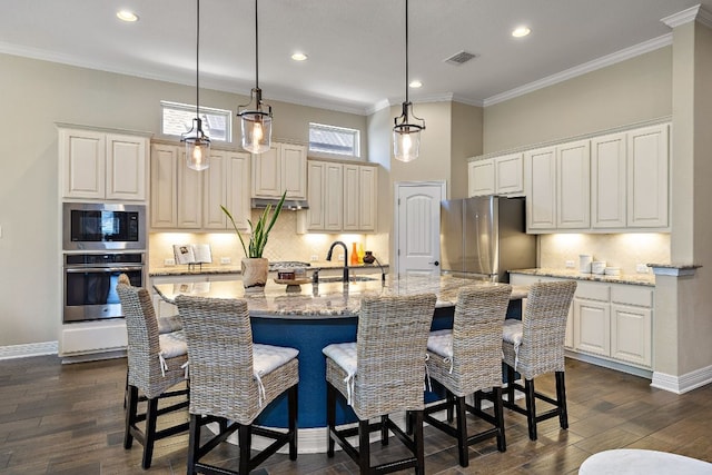 20012 Moorlynch Ave, Pflugerville, TX 78660 - kitchen with stainless steel appliances, crown molding, backsplash, dark wood-type flooring, and recessed lighting