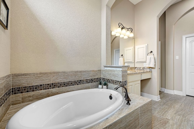 20012 Moorlynch Ave, Pflugerville, TX 78660 - bathroom with vanity and a bath