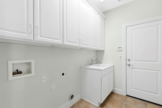 115 Caddo Lake Trl, Georgetown, TX 78633 - laundry room with electric dryer hookup, cabinet space, hookup for a washing machine, light tile patterned floors, and baseboards