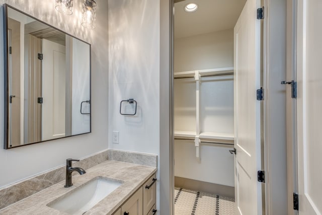 208 E Lakeshore Dr, Sunrise Beach, TX 78643 - bathroom featuring vanity, tile patterned floors, and recessed lighting