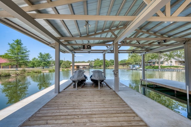 208 E Lakeshore Dr, Sunrise Beach, TX 78643 - dock area featuring boat lift and a water view