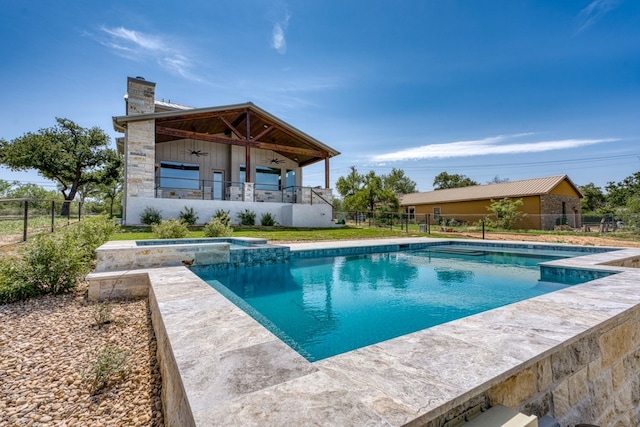 208 E Lakeshore Dr, Sunrise Beach, TX 78643 - view of pool featuring a pool with connected hot tub and a ceiling fan
