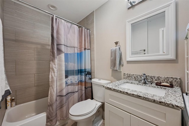 935 La Posada Dr Unit 243, Austin, TX 78752 - bathroom with toilet, vanity, and shower / tub combo