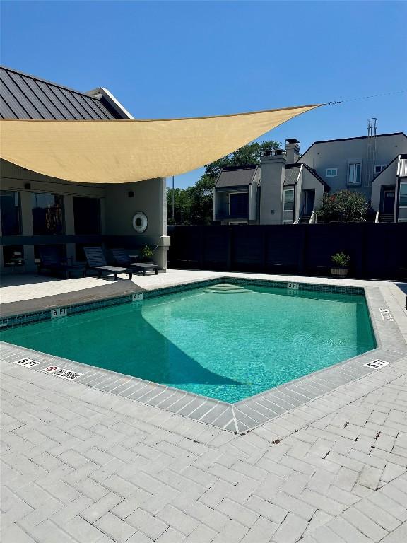 935 La Posada Dr Unit 243, Austin, TX 78752 - community pool featuring a patio area