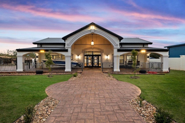 129 Cedar Dr, Horseshoe Bay, TX 78657 - view of front of property featuring french doors and stucco siding