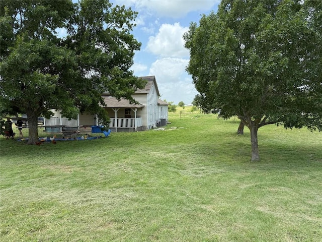 18543 Cyclone Branch Rd, Burlington, TX 76519 - view of green lawn with a porch and central air condition unit