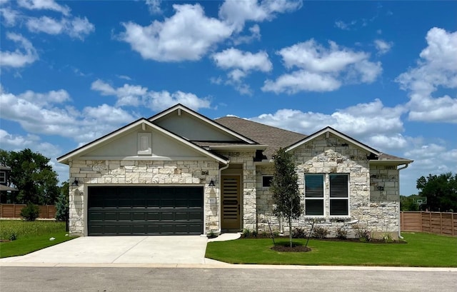 131 Courage Dr, Kyle, TX 78640 - french country home with stone siding, driveway, and an attached garage