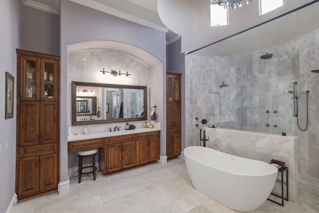 700 Zen Gardens Ter, Austin, TX 78732 - full bathroom with a walk in shower, crown molding, a freestanding bath, vanity, and tile walls