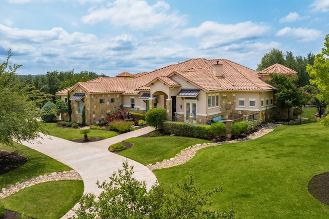700 Zen Gardens Ter, Austin, TX 78732 - mediterranean / spanish-style home featuring stucco siding, a chimney, a tile roof, and stone siding