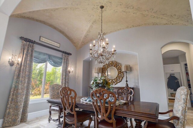 700 Zen Gardens Ter, Austin, TX 78732 - dining area featuring arched walkways, a chandelier, and vaulted ceiling