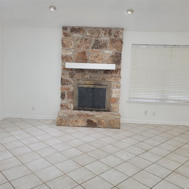 405 S Blue Ridge Parkway, Cedar Park, TX 78613 - unfurnished living room featuring a stone fireplace and baseboards
