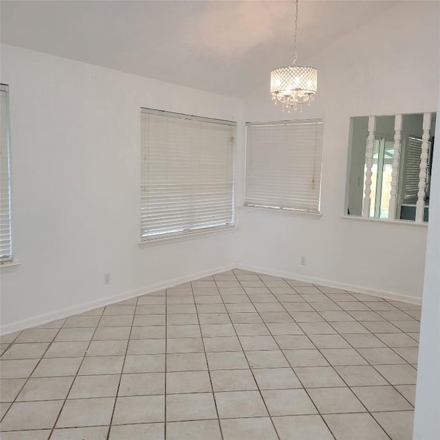 405 S Blue Ridge Parkway, Cedar Park, TX 78613 - spare room featuring a chandelier, baseboards, and vaulted ceiling