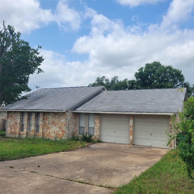 405 S Blue Ridge Parkway, Cedar Park, TX 78613 - view of front of property featuring concrete driveway, stone siding, a garage, and a shingled roof