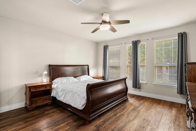 755 Hometown Pkwy, Kyle, TX 78640 - bedroom with baseboards, dark wood finished floors, and ceiling fan