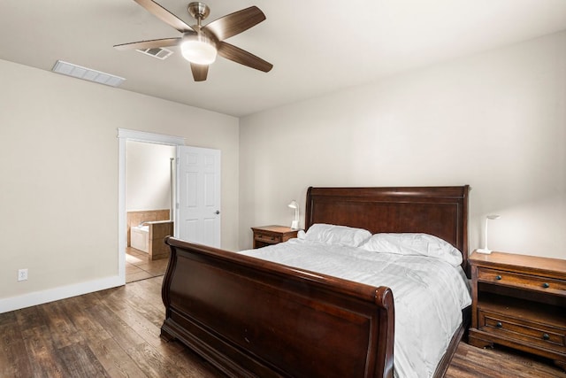 755 Hometown Pkwy, Kyle, TX 78640 - bedroom with wood finished floors, baseboards, ceiling fan, and ensuite bath