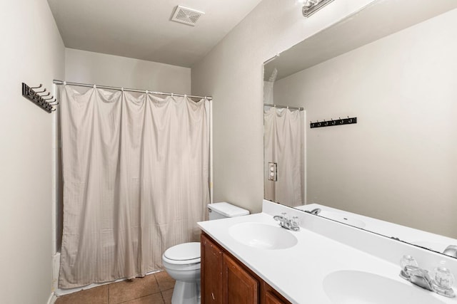 755 Hometown Pkwy, Kyle, TX 78640 - full bath with double vanity, toilet, tile patterned flooring, and shower / bath combo