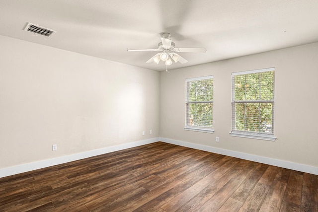 755 Hometown Pkwy, Kyle, TX 78640 - empty room featuring dark wood-type flooring, baseboards, and a ceiling fan