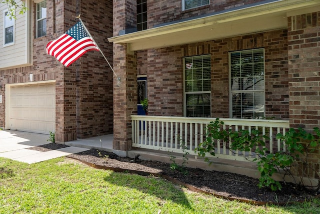 755 Hometown Pkwy, Kyle, TX 78640 - view of side of property with a porch, an attached garage, brick siding, and driveway