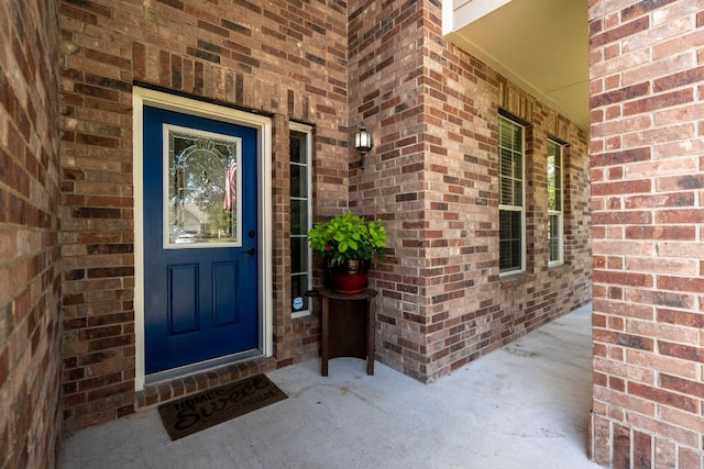 755 Hometown Pkwy, Kyle, TX 78640 - view of exterior entry with a porch and brick siding