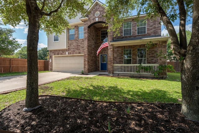 755 Hometown Pkwy, Kyle, TX 78640 - traditional-style house with a porch, driveway, an attached garage, and brick siding