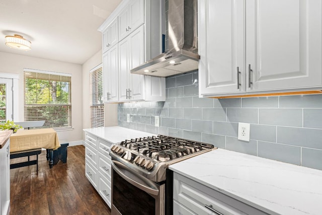 755 Hometown Pkwy, Kyle, TX 78640 - kitchen featuring wall chimney range hood, stainless steel gas range, dark wood finished floors, baseboards, and tasteful backsplash