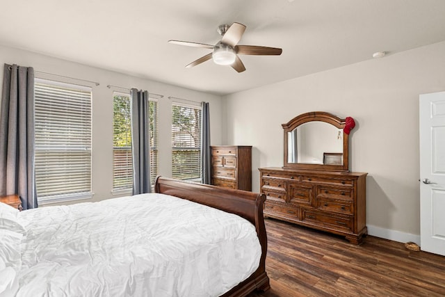 755 Hometown Pkwy, Kyle, TX 78640 - bedroom featuring dark wood-style floors, baseboards, and ceiling fan