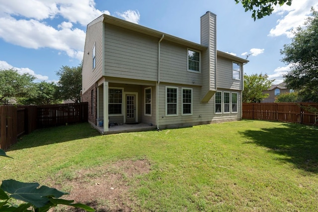 755 Hometown Pkwy, Kyle, TX 78640 - back of house with a chimney and a patio area
