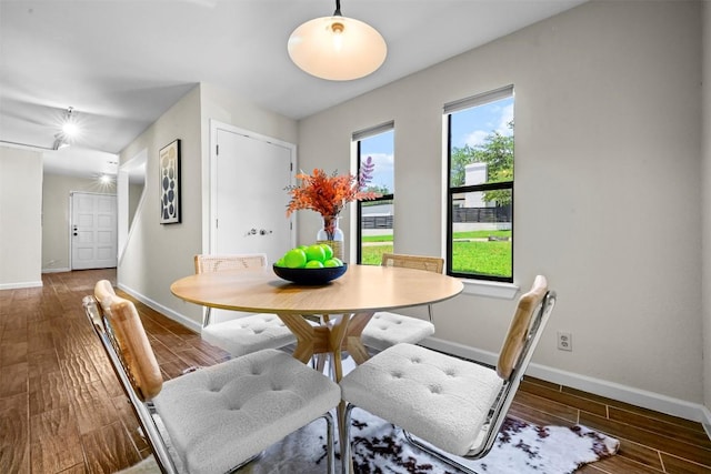 2814 Windsor Rd, Austin, TX 78703 - dining space featuring baseboards and wood finished floors