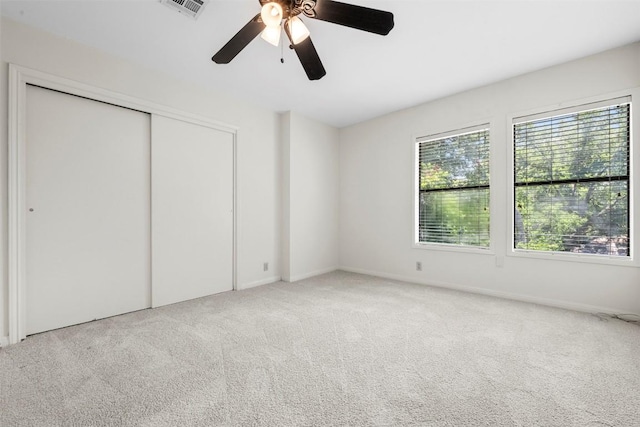 2814 Windsor Rd, Austin, TX 78703 - unfurnished bedroom featuring carpet flooring, a closet, and ceiling fan