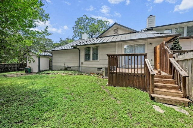 2814 Windsor Rd, Austin, TX 78703 - rear view of property with a standing seam roof, a chimney, metal roof, and a wooden deck