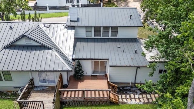 2814 Windsor Rd, Austin, TX 78703 - back of house featuring a standing seam roof, metal roof, a deck, and stairs