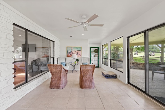 618 Hi Stirrup, Horseshoe Bay, TX 78657 - sunroom with a ceiling fan, tile patterned floors, and recessed lighting