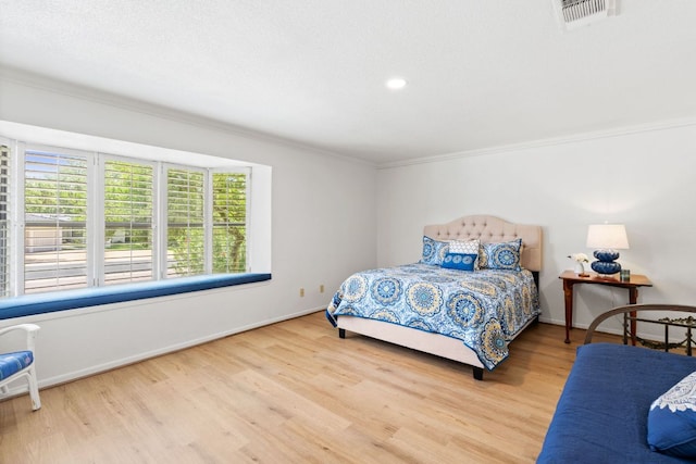618 Hi Stirrup, Horseshoe Bay, TX 78657 - bedroom featuring crown molding, wood finished floors, baseboards, and recessed lighting