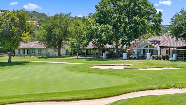 618 Hi Stirrup, Horseshoe Bay, TX 78657 - view of home's community featuring an area to practice putting and view of golf course