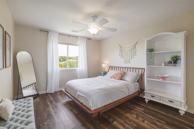 3437 Mulberry Creek Dr, Austin, TX 78732 - bedroom with dark wood-type flooring, a ceiling fan, and baseboards