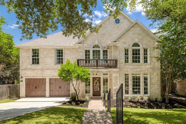 3437 Mulberry Creek Dr, Austin, TX 78732 - view of front facade with concrete driveway, stone siding, a garage, and a balcony