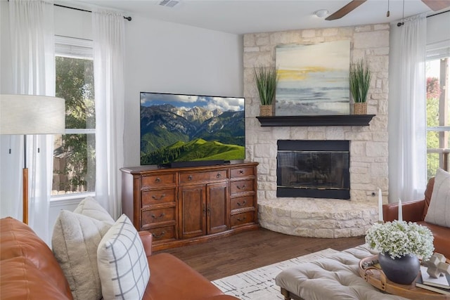 3437 Mulberry Creek Dr, Austin, TX 78732 - living room with a ceiling fan, wood finished floors, and a fireplace