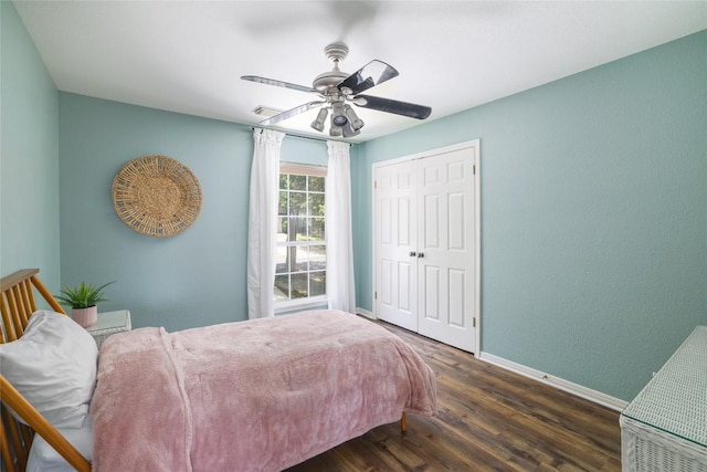 3437 Mulberry Creek Dr, Austin, TX 78732 - bedroom featuring baseboards, wood finished floors, a closet, and ceiling fan