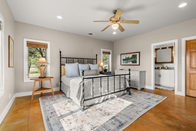 492 Billy Sisson Rd, Johnson City, TX 78636 - bedroom featuring multiple windows, baseboards, recessed lighting, and finished concrete floors