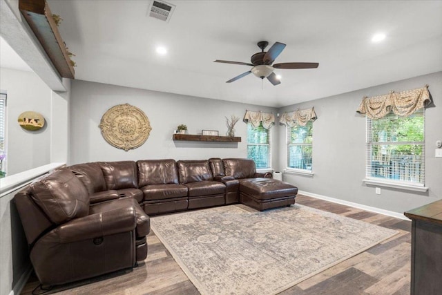 2313 Jake Pickle Pass, Leander, TX 78641 - living room with ceiling fan, wood finished floors, and recessed lighting