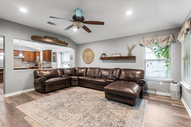2313 Jake Pickle Pass, Leander, TX 78641 - living room featuring ceiling fan, wood finished floors, lofted ceiling, and recessed lighting