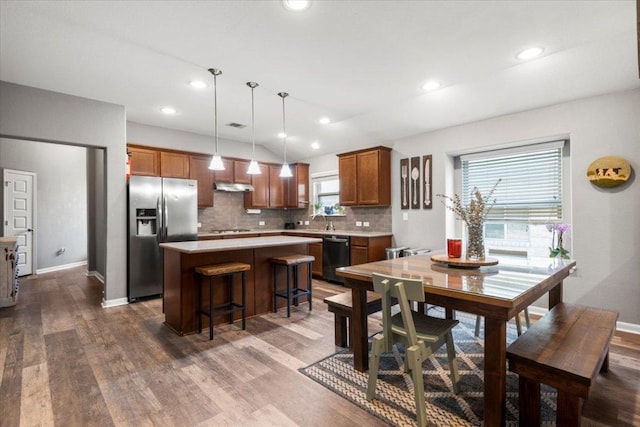 2313 Jake Pickle Pass, Leander, TX 78641 - dining area with dark wood-style flooring and recessed lighting