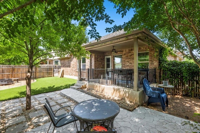 2313 Jake Pickle Pass, Leander, TX 78641 - fenced backyard with a patio area and an outdoor fire pit