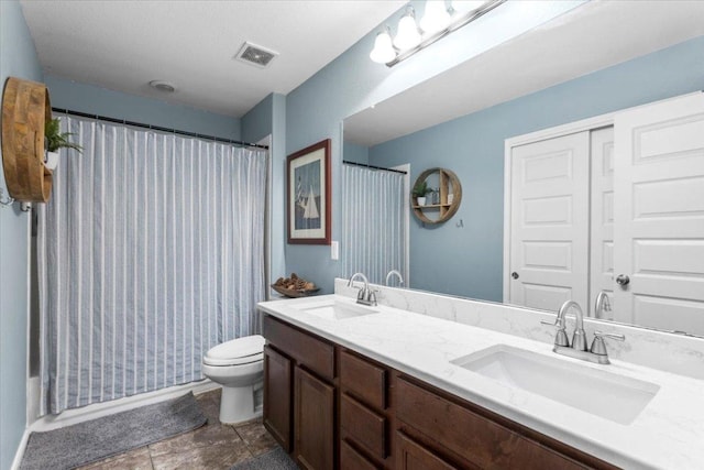 2313 Jake Pickle Pass, Leander, TX 78641 - full bath featuring double vanity and toilet
