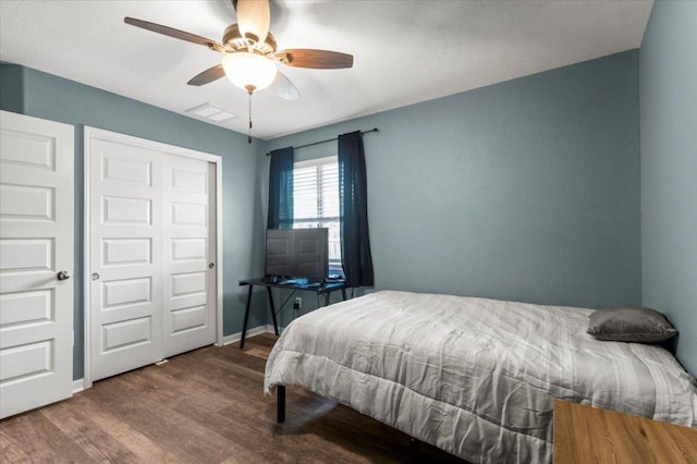 2313 Jake Pickle Pass, Leander, TX 78641 - bedroom featuring wood finished floors, ceiling fan, and a closet