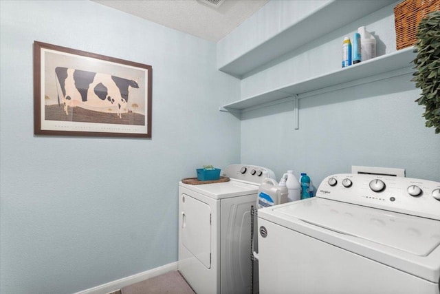 2313 Jake Pickle Pass, Leander, TX 78641 - washroom with washing machine and clothes dryer and baseboards