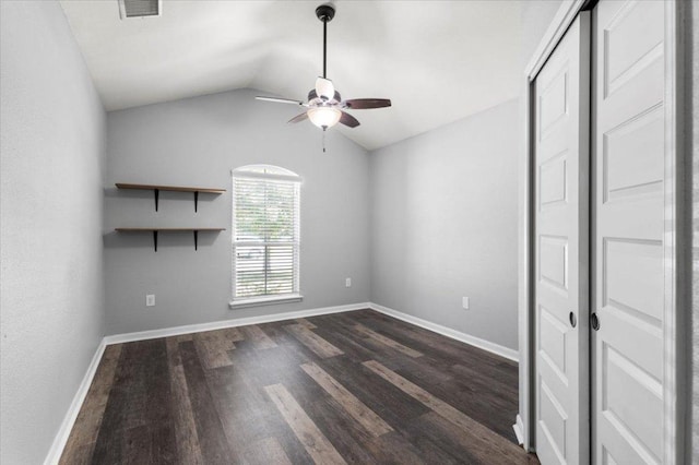 2313 Jake Pickle Pass, Leander, TX 78641 - empty room featuring a ceiling fan, dark wood-style flooring, and vaulted ceiling