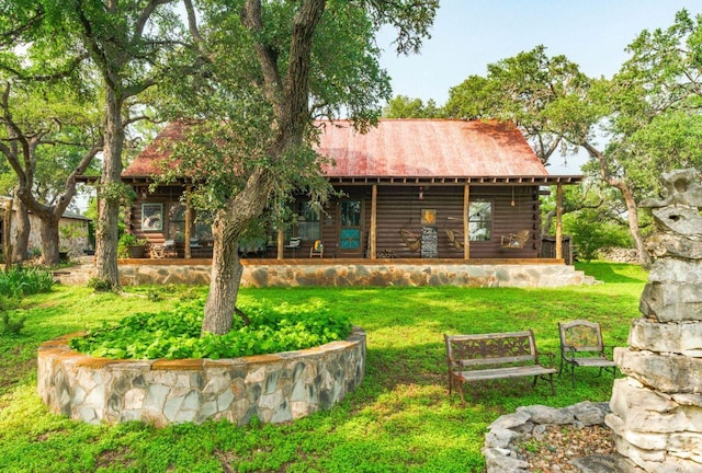 0000 Oakwood Loop, San Marcos, TX 78666 - rear view of property featuring a yard, log siding, and metal roof