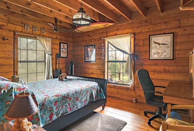 0000 Oakwood Loop, San Marcos, TX 78666 - bedroom featuring wood walls and hardwood / wood-style flooring